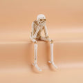 Halloween Skeleton Shelf Sitters with Dangling Legs and See Hear Speak No Evil Poses - Image 1