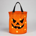 Kids' Halloween Trick or Treat Bag with LED Light Up Pumpkin Design for Candy Collection - Image 1