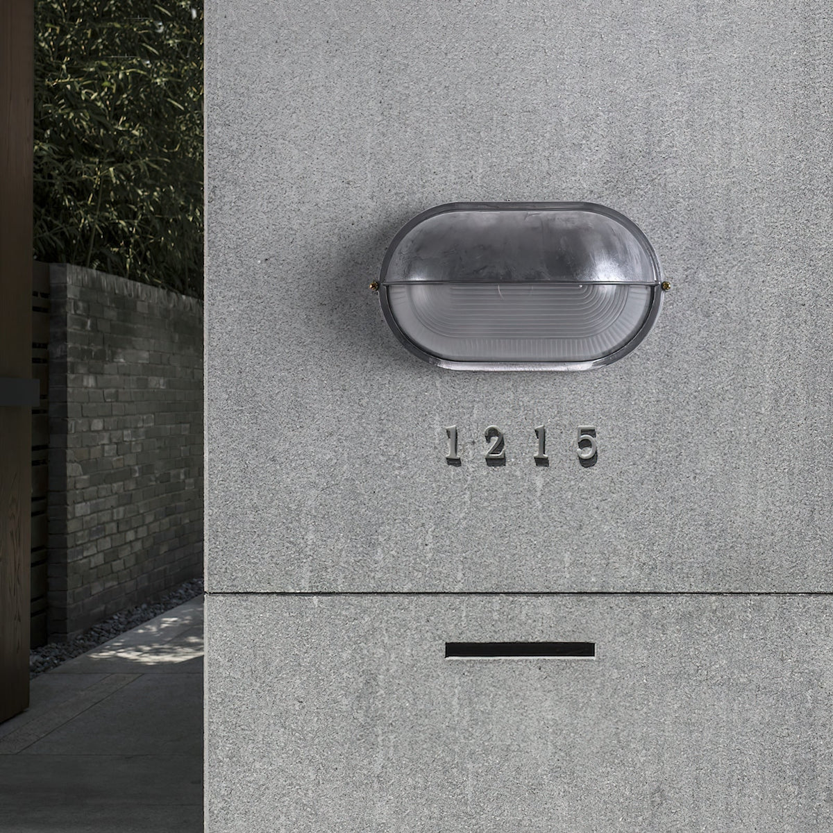 Outdoor Bulkhead Wall Light with Oval Shield and Ribbed Glass Diffuser - Image 9