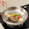 Stainless Steel Frying Pan with Hammered Interior and Glass Lid - Image 1