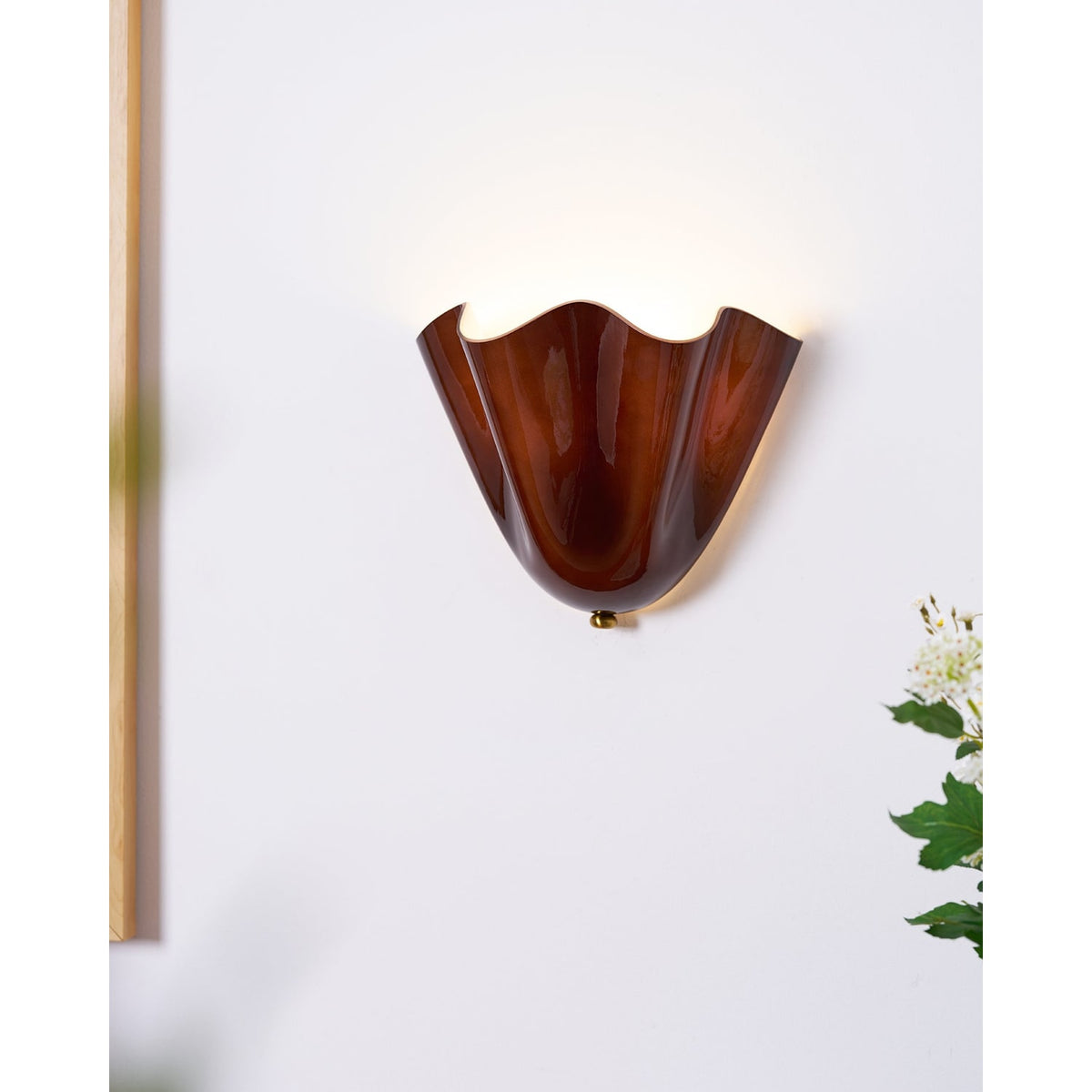 Wall Sconce with Wavy Glass Shade and Warm Ambient Lighting - Image 12