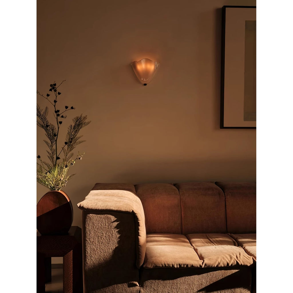Wall Sconce with Wavy Glass Shade and Warm Ambient Lighting - Image 16