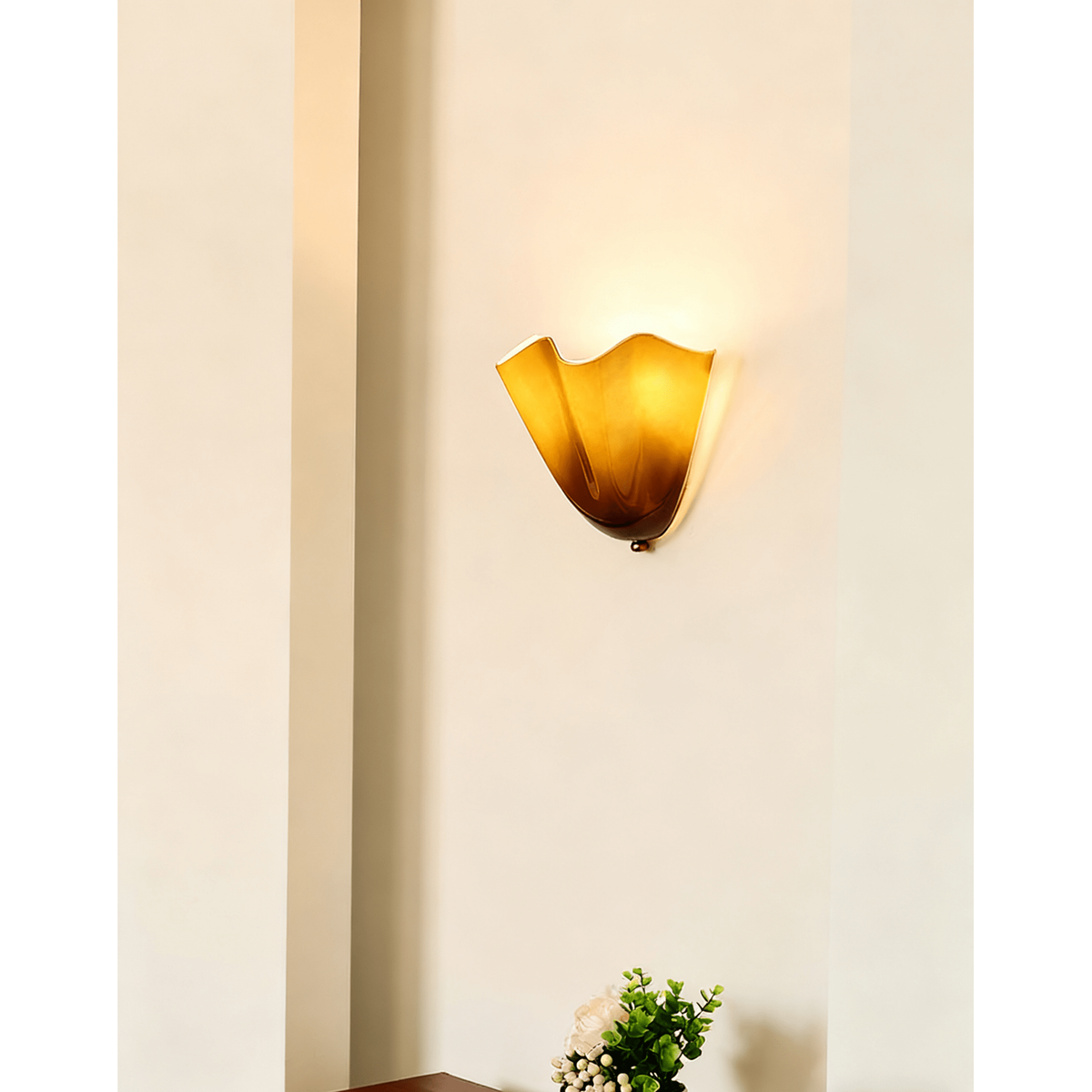 Wall Sconce with Wavy Glass Shade and Warm Ambient Lighting - Image 2