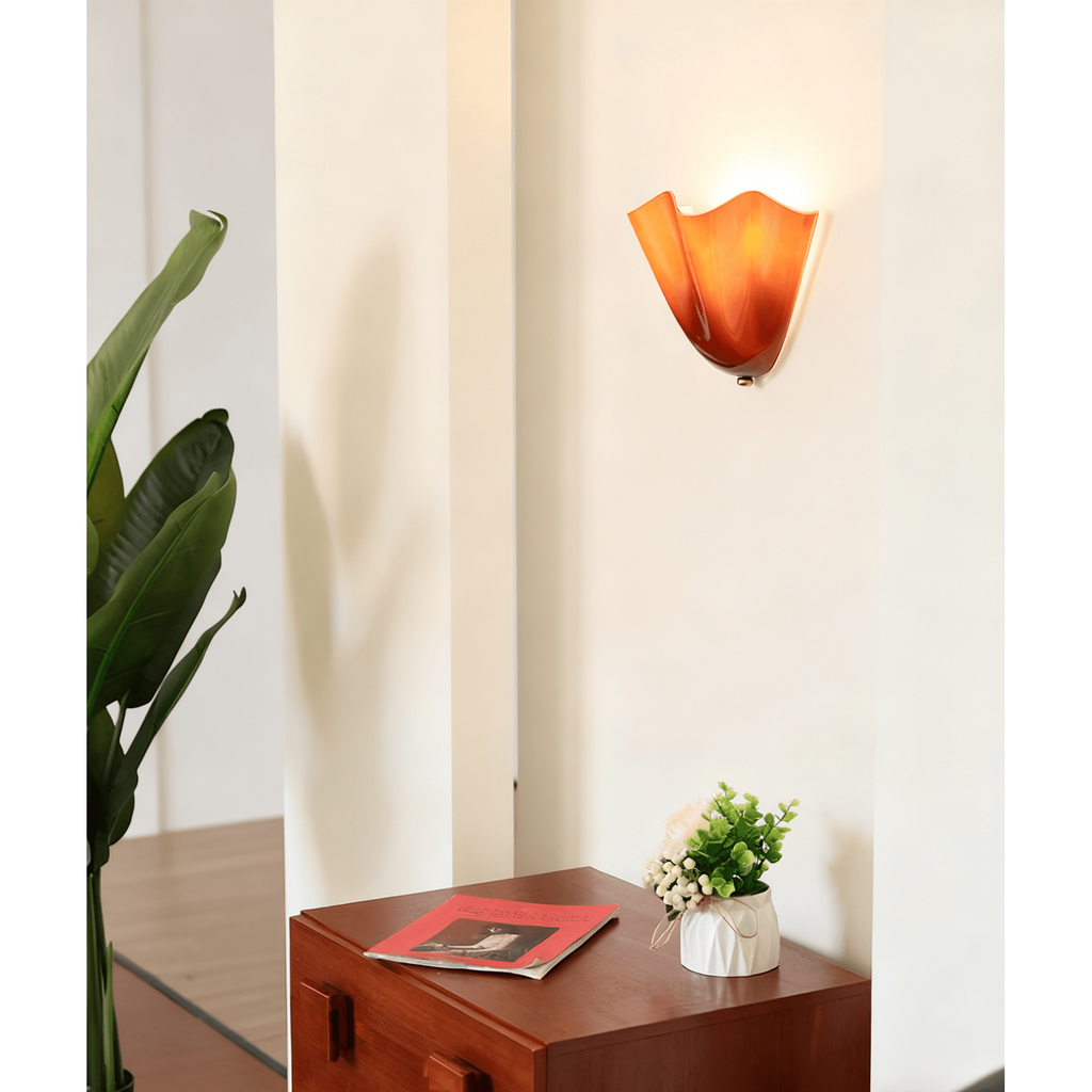 Wall Sconce with Wavy Glass Shade and Warm Ambient Lighting - Image 4