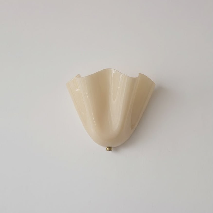Wall Sconce with Wavy Glass Shade and Warm Ambient Lighting - Image 42