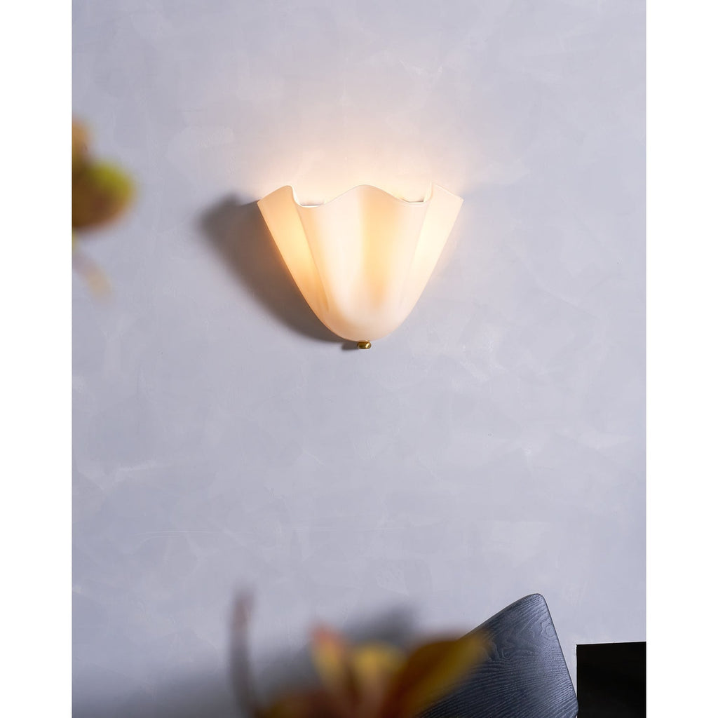 Wall Sconce with Wavy Glass Shade and Warm Ambient Lighting - Image 45