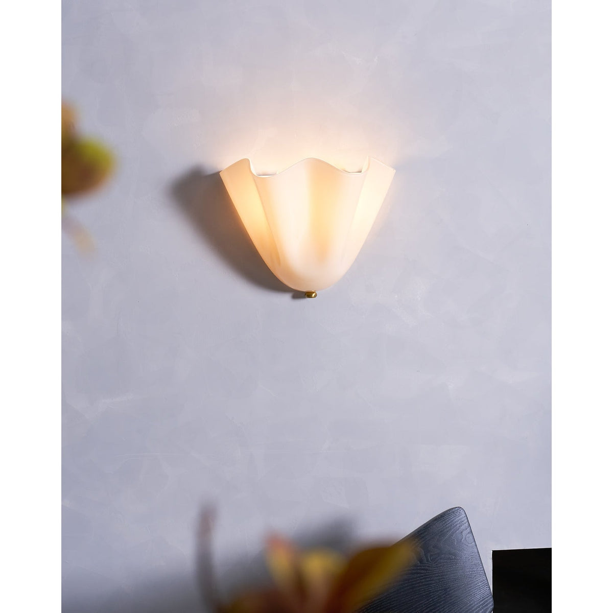 Wall Sconce with Wavy Glass Shade and Warm Ambient Lighting - Image 45