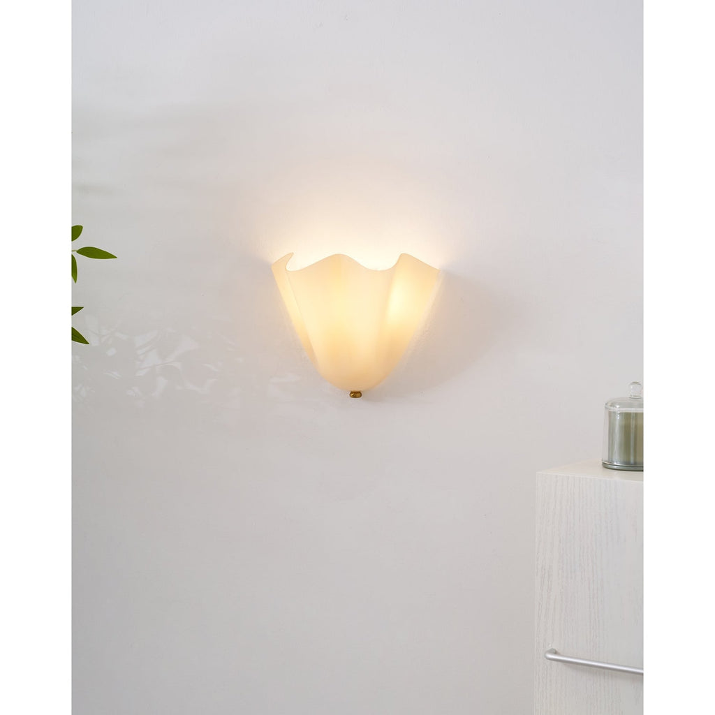 Wall Sconce with Wavy Glass Shade and Warm Ambient Lighting - Image 50